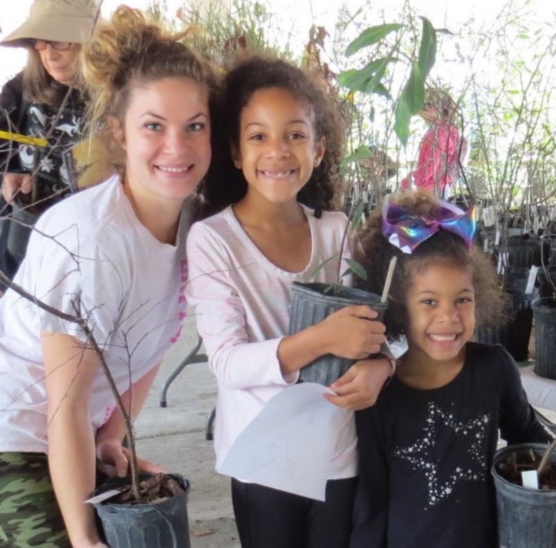 Family at Arbor Day tree giveaway.